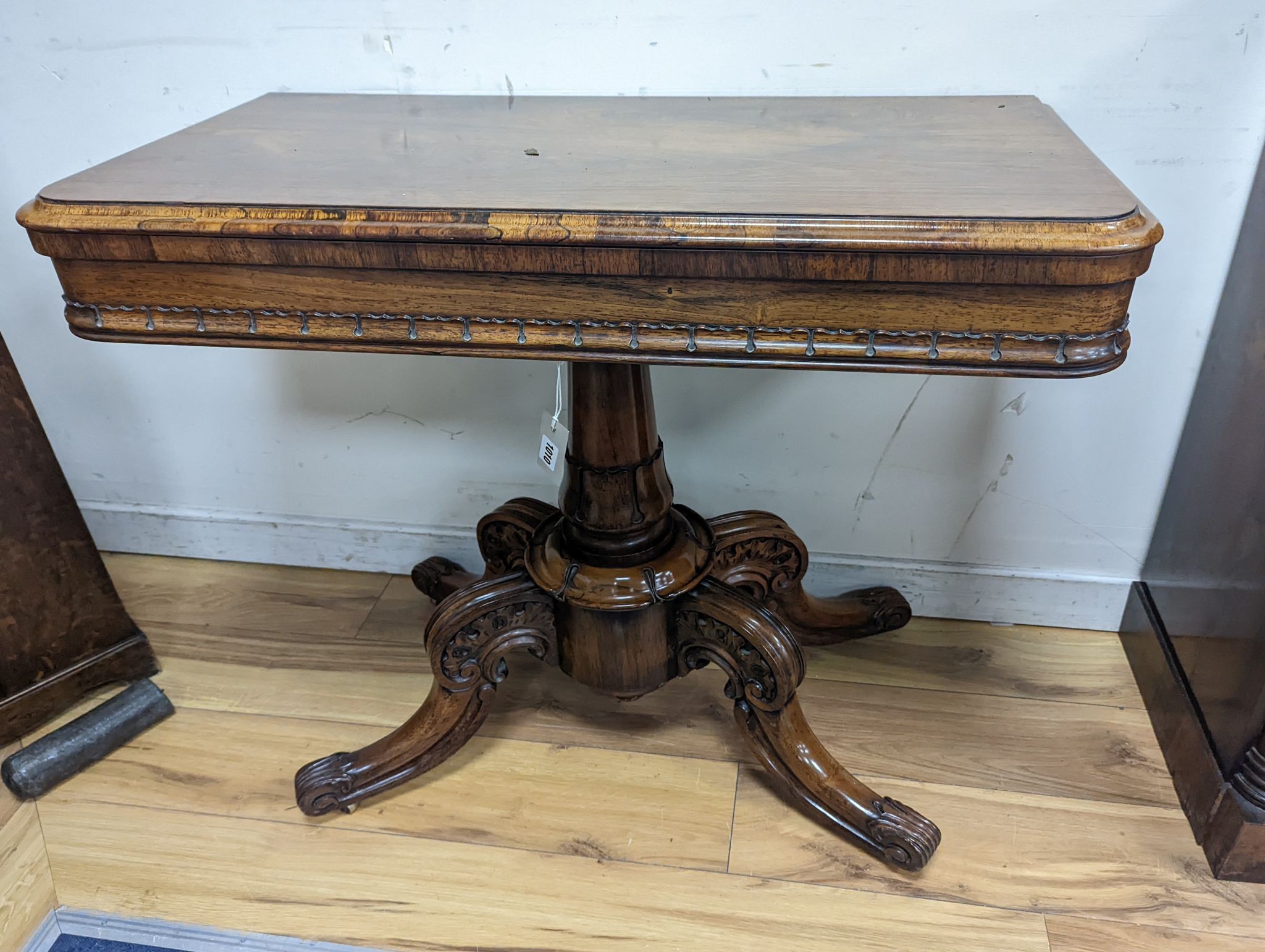 A good William IV rectangular rosewood folding card table, stamped with makers mark internally ‘T. Phillips, cabinet & chair manufacturer, 18 Finsbury Place, South Finsbury Square, London’ width 91cm, depth 45cm, height